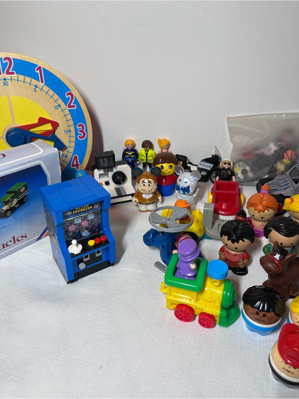 Assorted Kids Toy Figures and trucks. Learn to tell time and more
